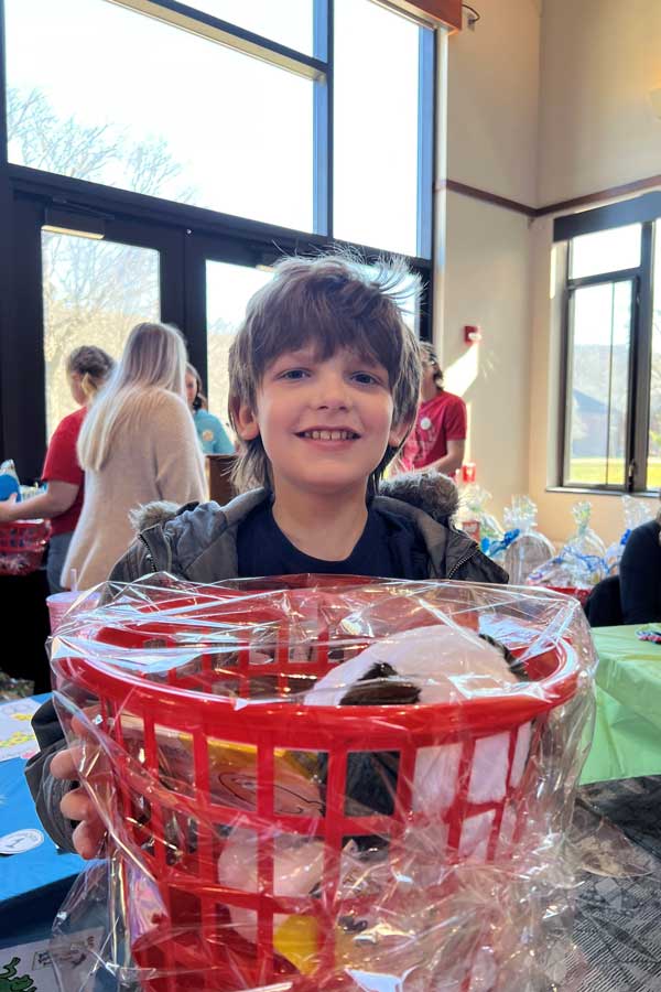 a child with a goodie-basket